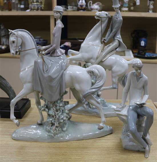 Three Lladro figures including horses and riders and a seated boy tallest 49cm